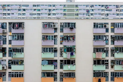 Tall apartment complex with rows of balconies