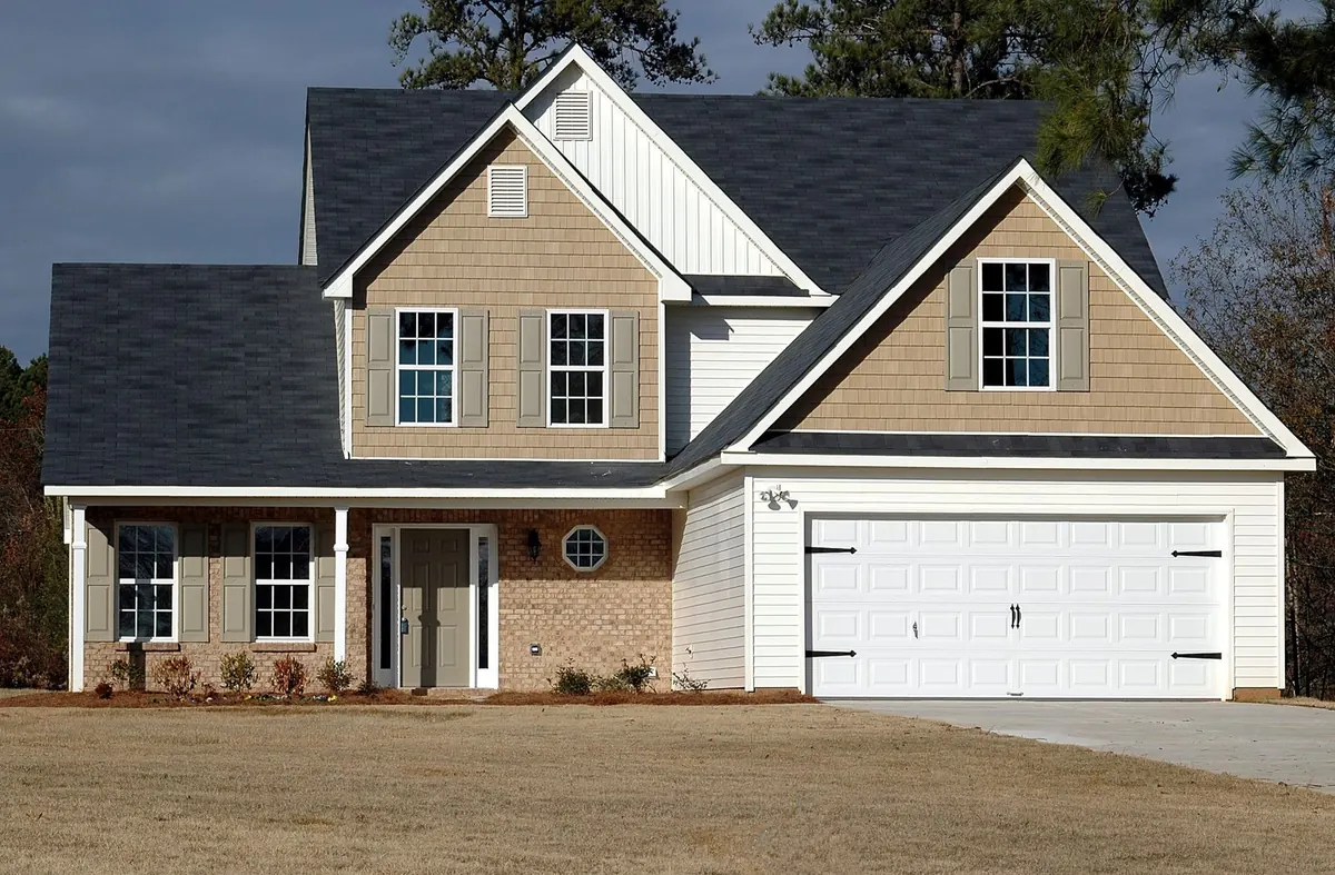 Two-story house with a two-car garage and brick front
